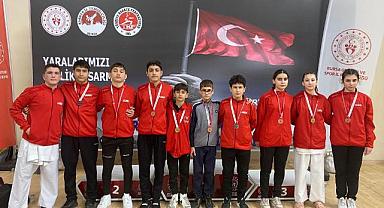 MADALYALARI BAŞKAN BABAOĞLU'NA ARMAĞAN ETTİLER